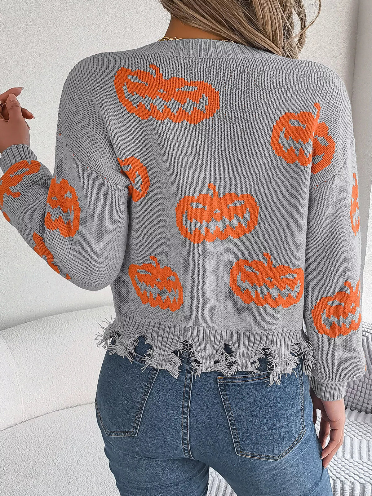 Pumpkin Distressed Hem Sweater in gray, back view