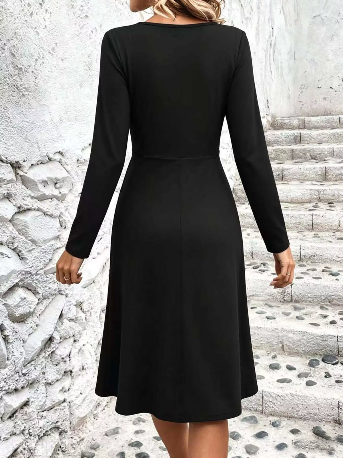 Black long sleeve ruched-front midi dress, back view