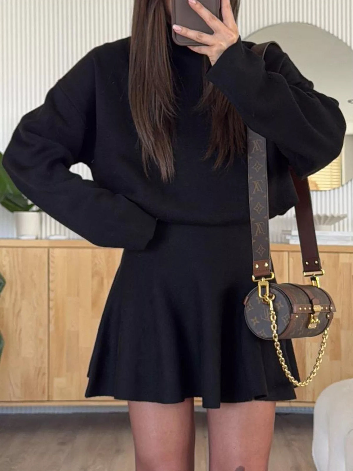 Black mock neck knit top and flared skirt set