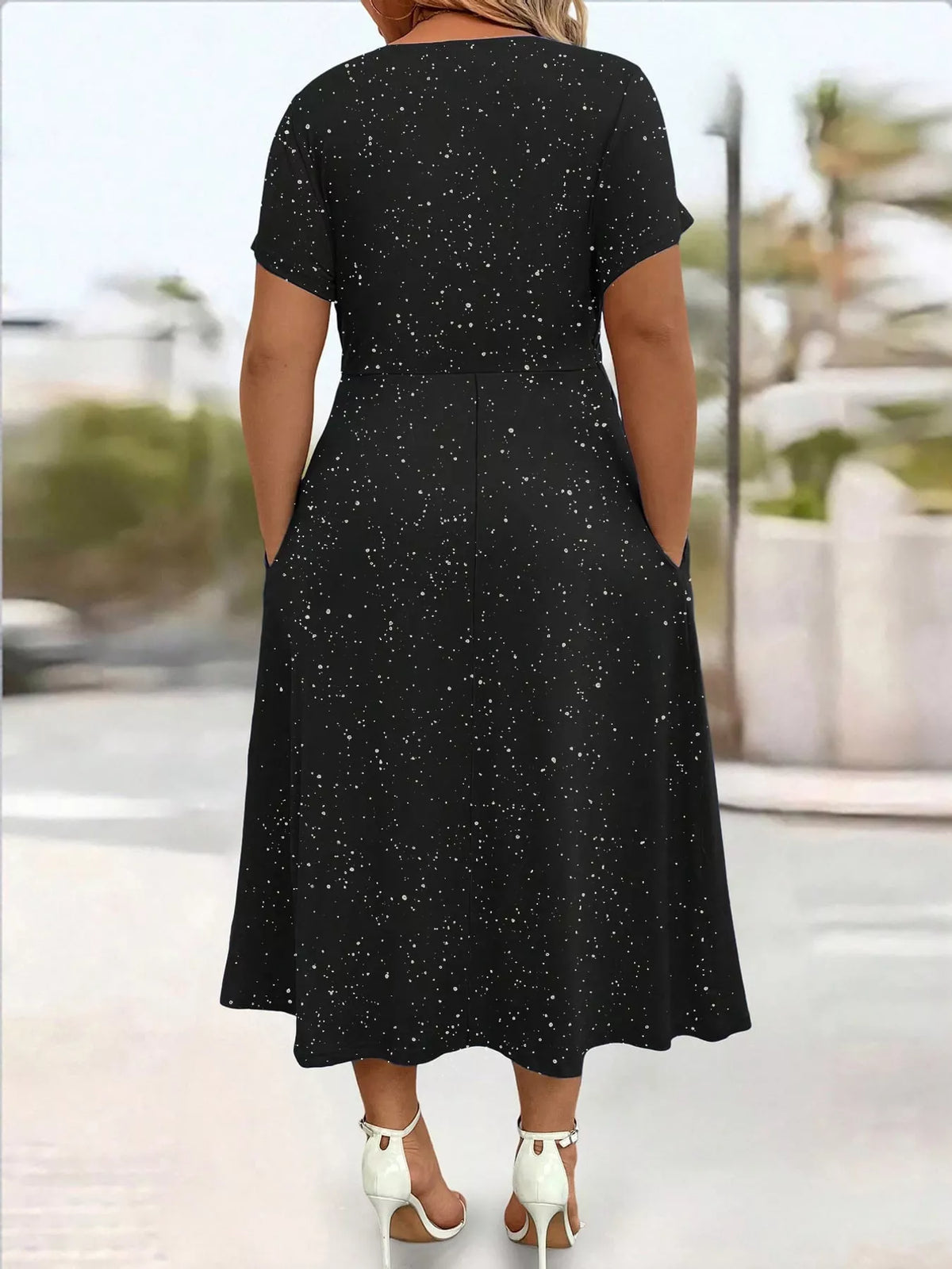 Black speckled short sleeve midi dress with pockets, back view