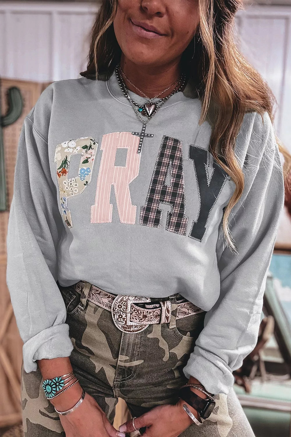 Gray floral and plaid PRAY patch sweatshirt, patch lettering view