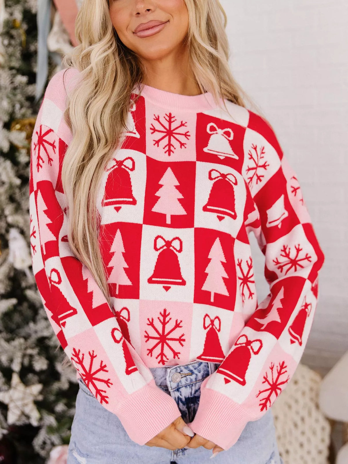 Pink and red Christmas patchwork round neck sweater — front view
