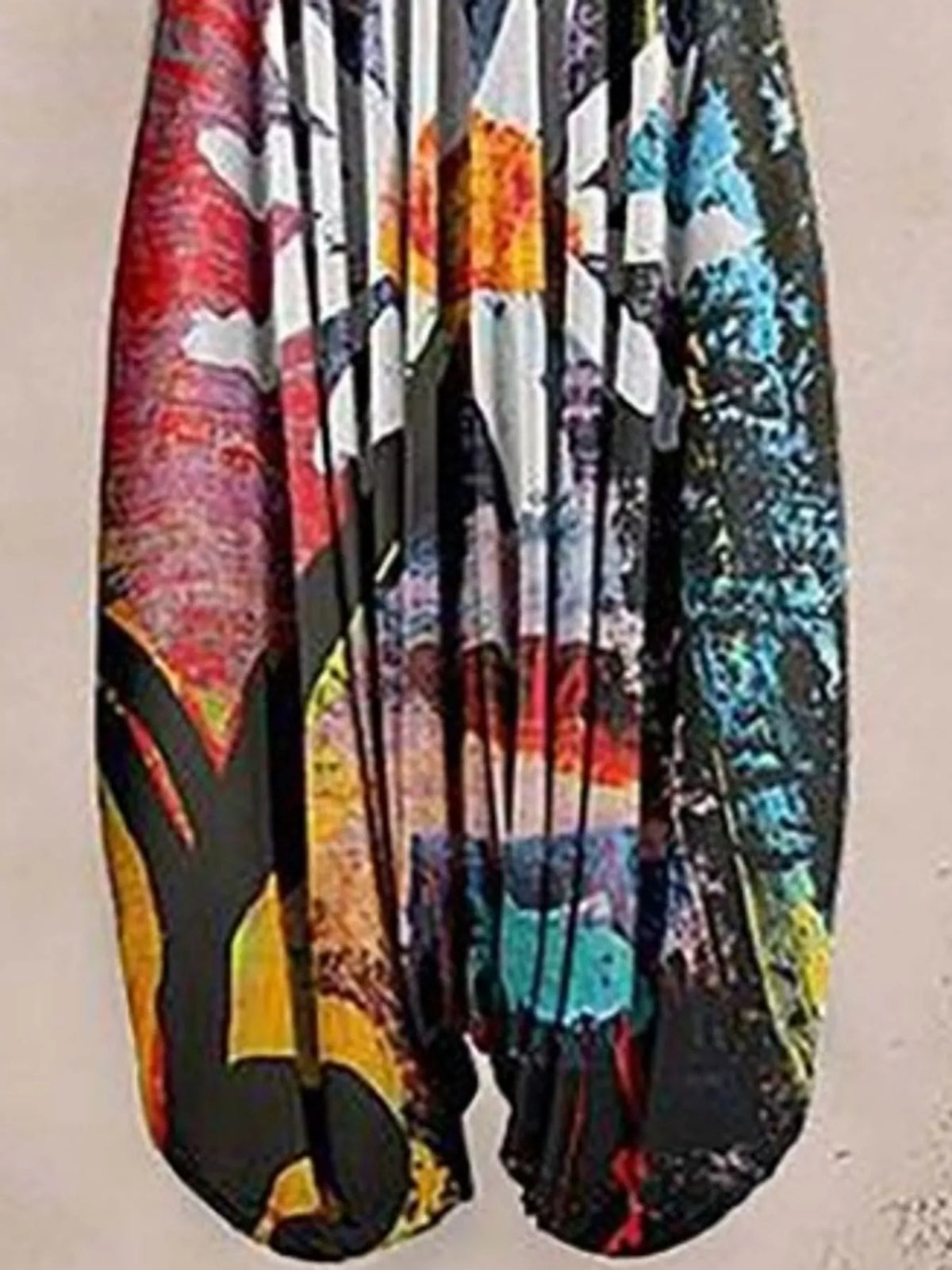 Multicolor daisy-print V-neck sleeveless jumpsuit, leg and print detail