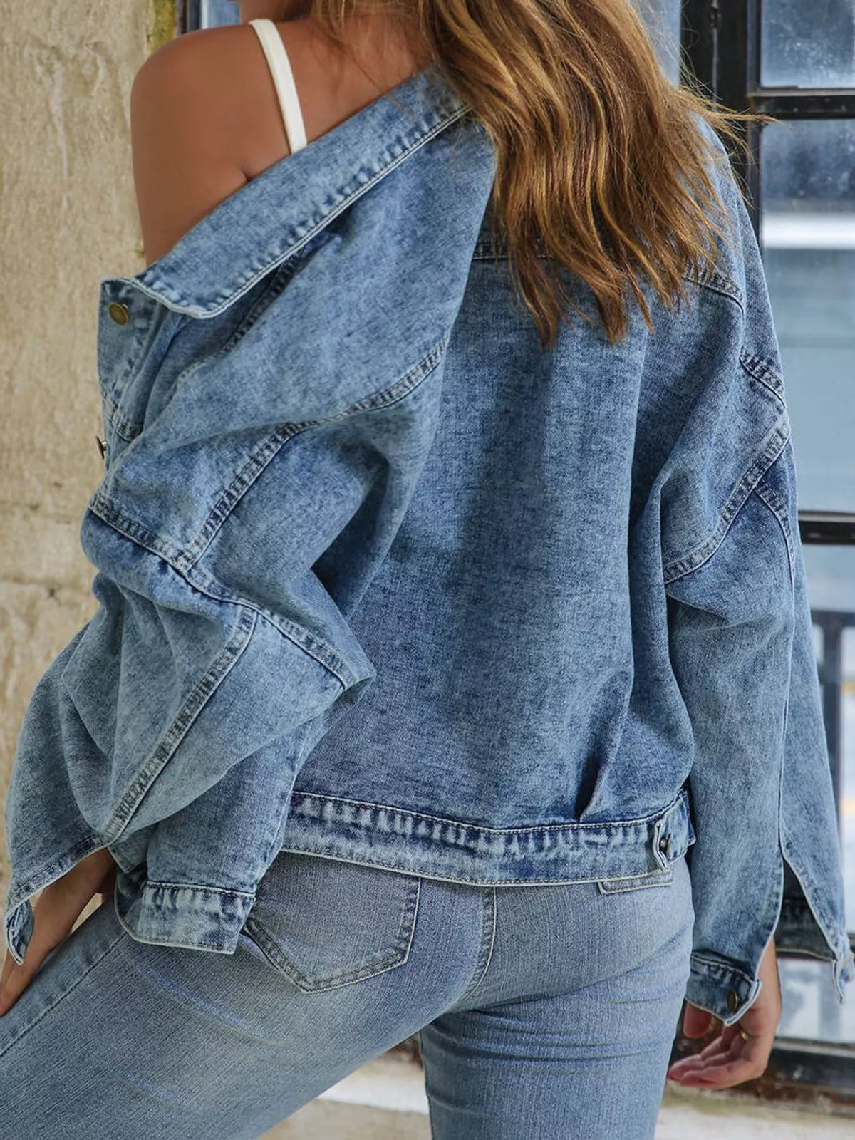 Blue button-up dropped shoulder denim jacket — back view