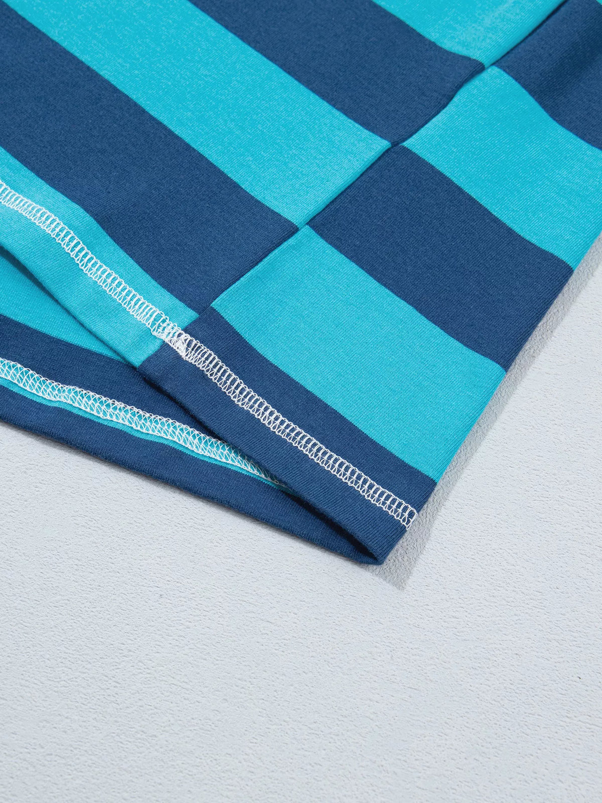 Striped polo top, bottom hem detail