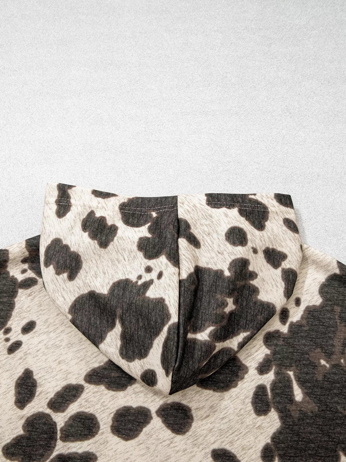 Cow Print Pocket Hoodie in multicolour, construction detail
