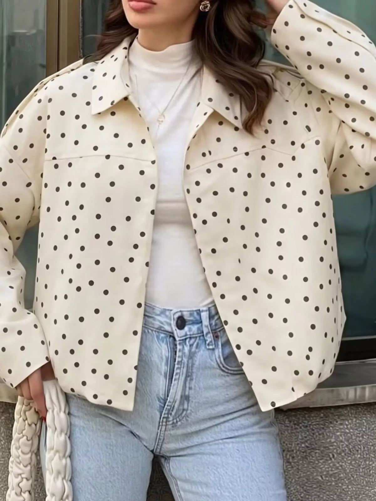 Cream polka dot zip-up jacket — front view