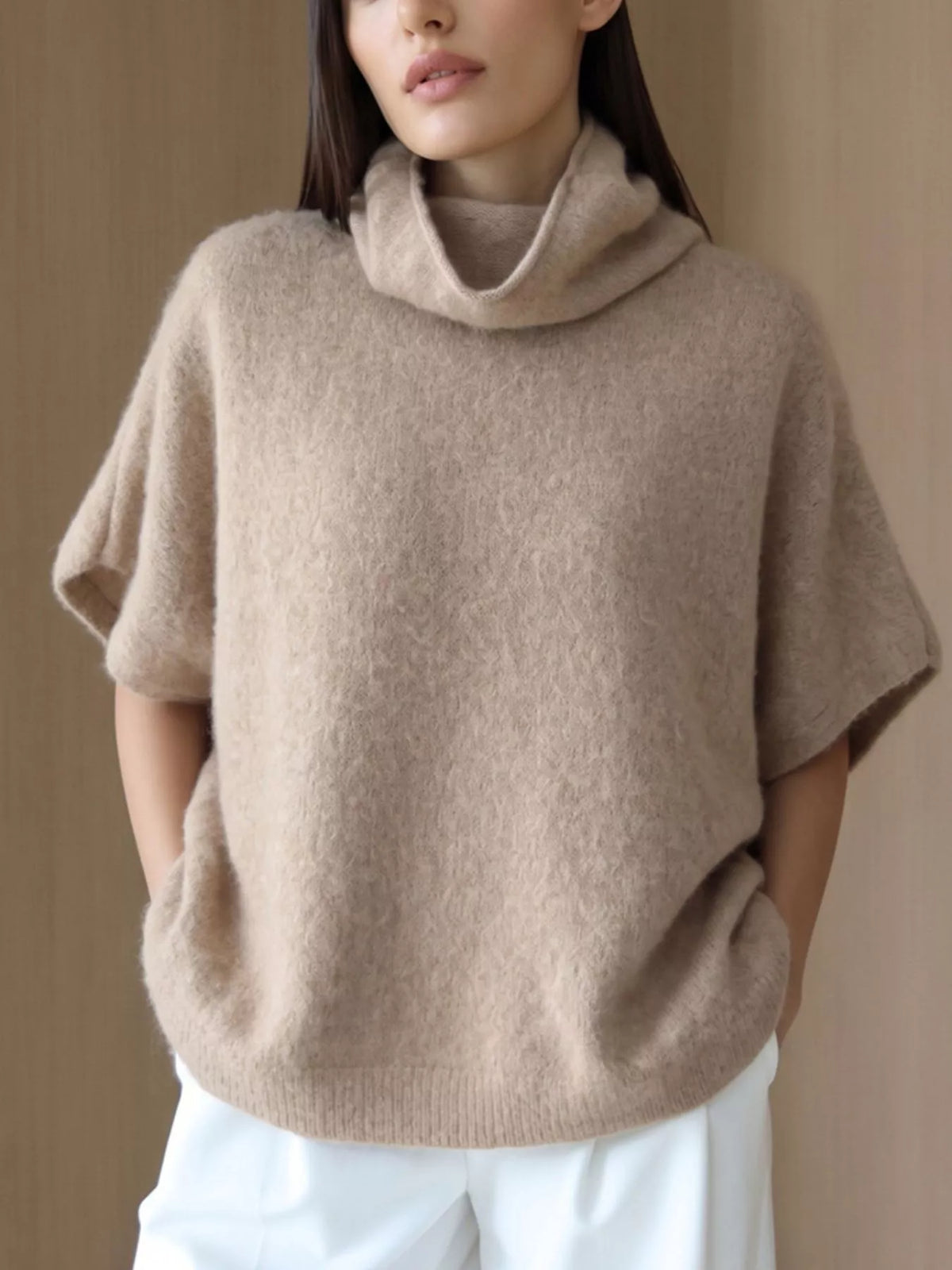 Fuzzy short-sleeve turtleneck sweater in tan, front view showing texture