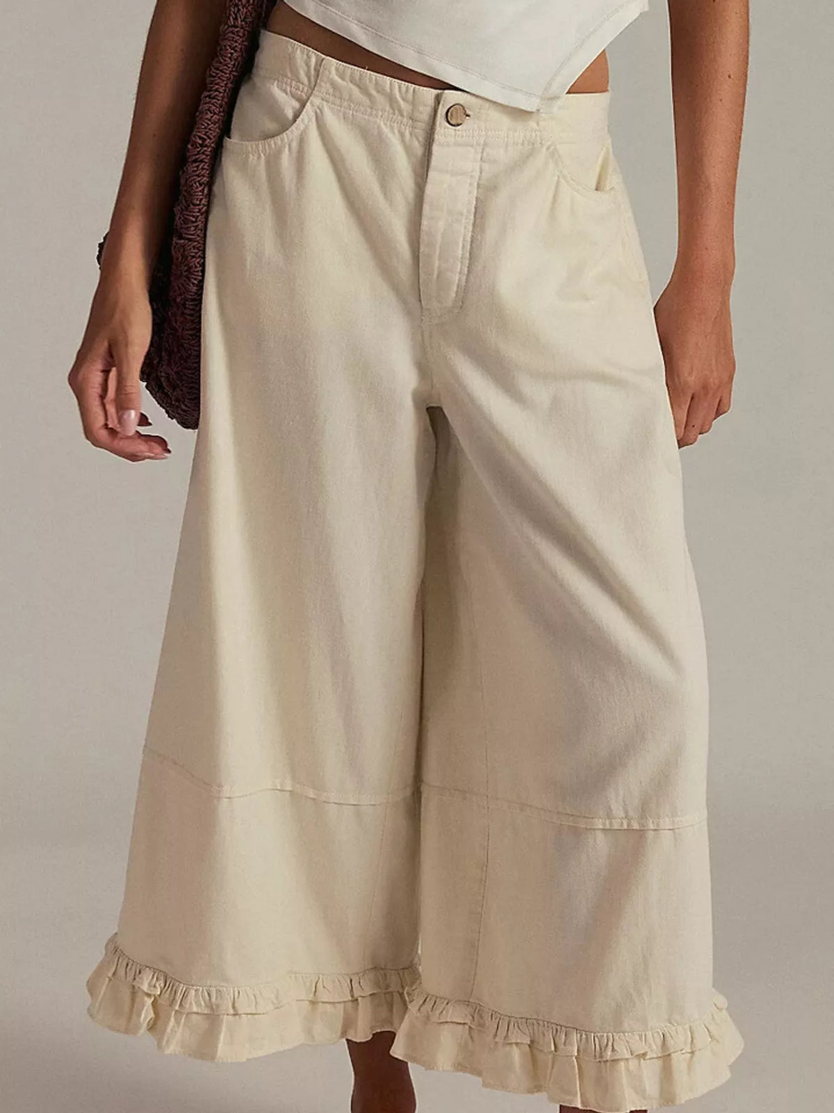 Cream wide-leg ruffle-hem jeans