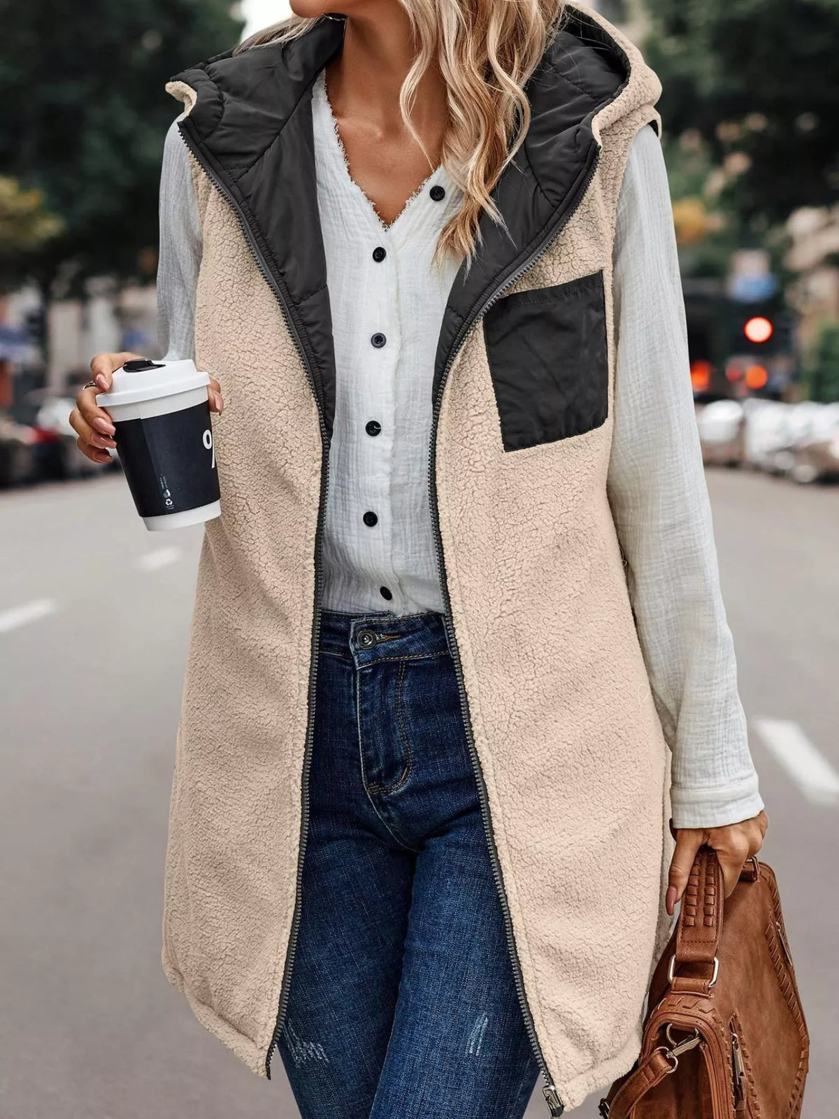 Black hooded sherpa-lined puffer vest, sherpa reverse view