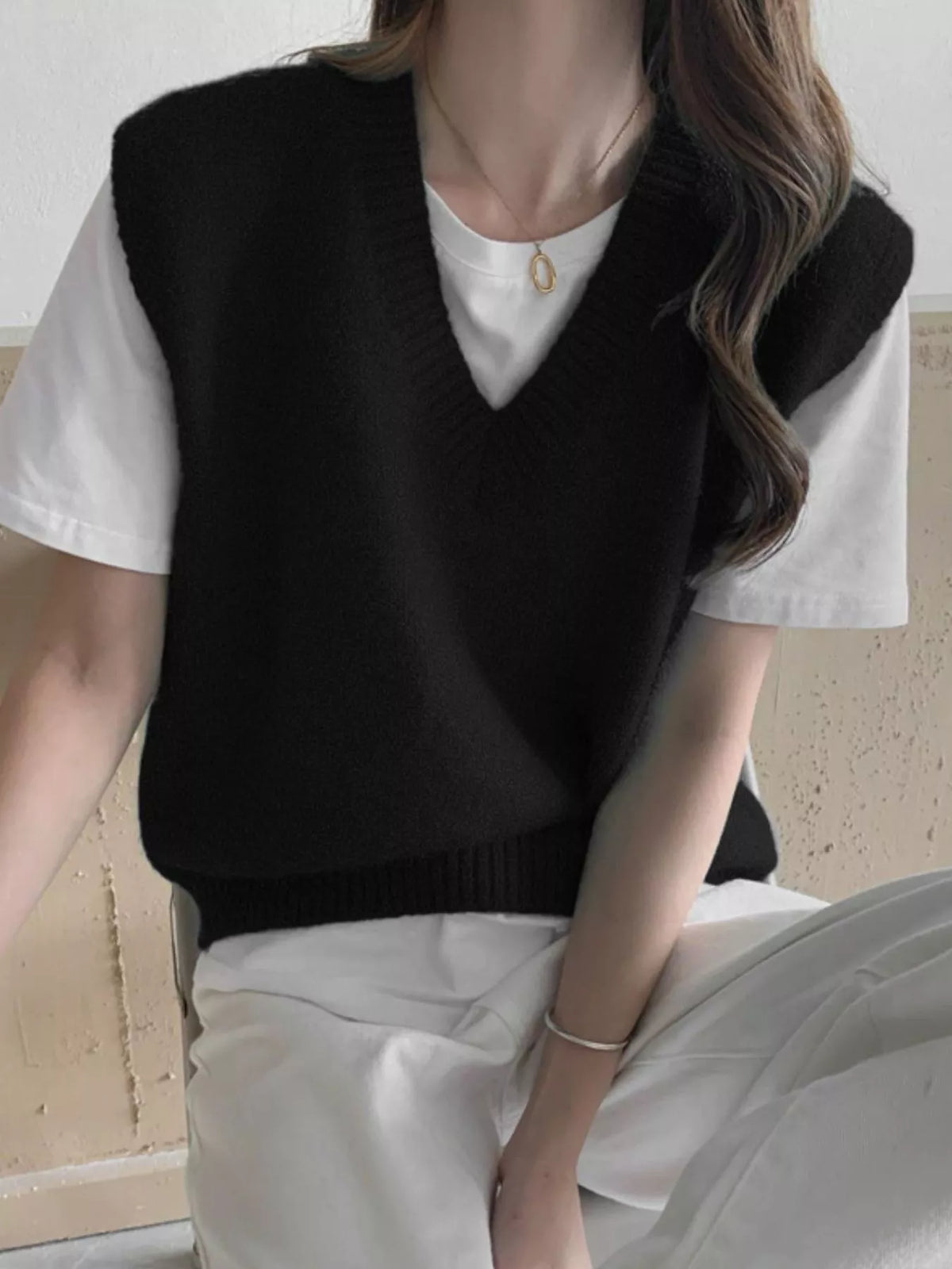 Black v-neck knit sweater vest