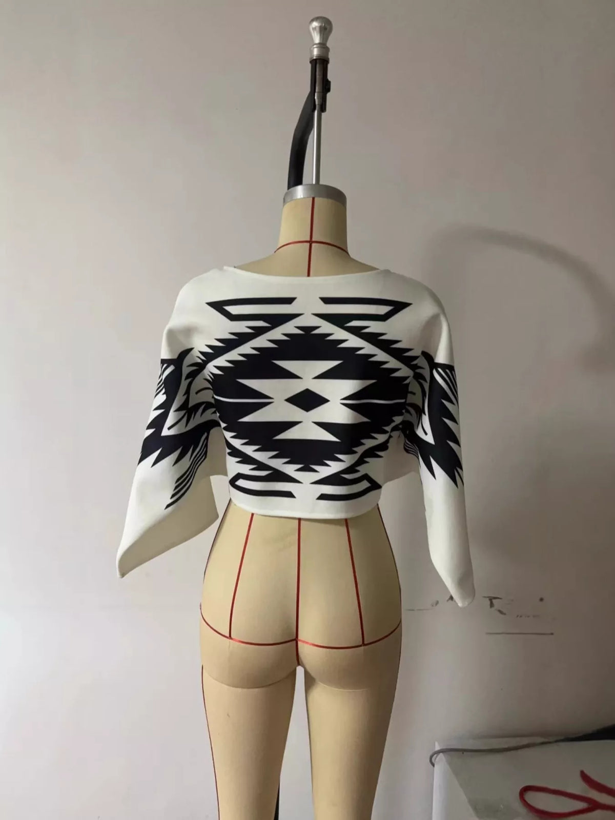 Geometric knit sweater, black and white mannequin front