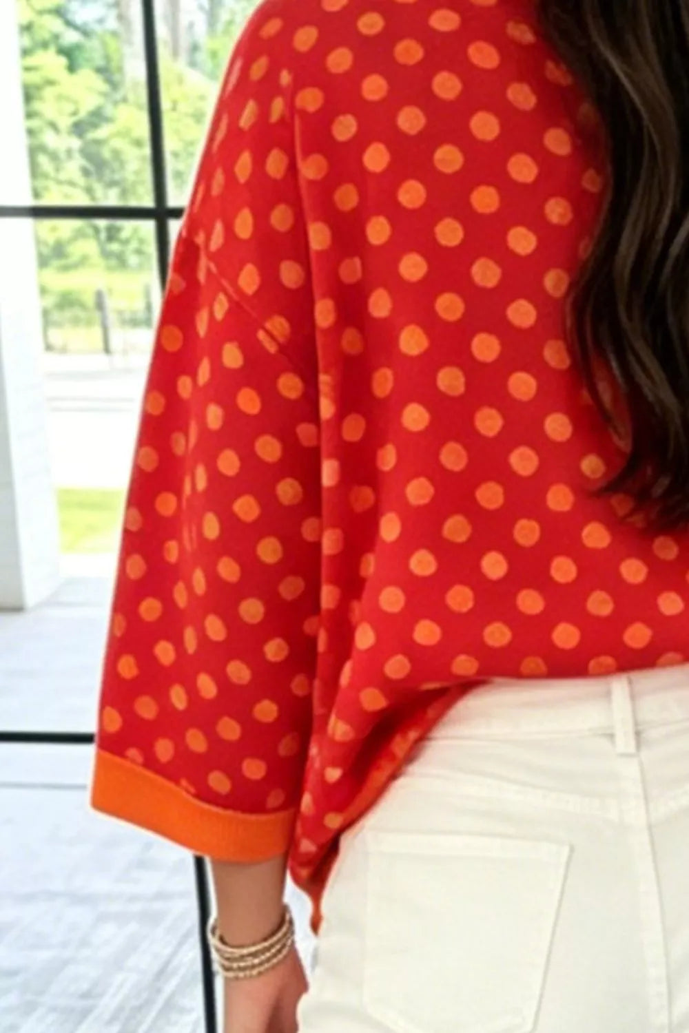 Polka Dot Sweatshirt in red with orange dots, construction detail