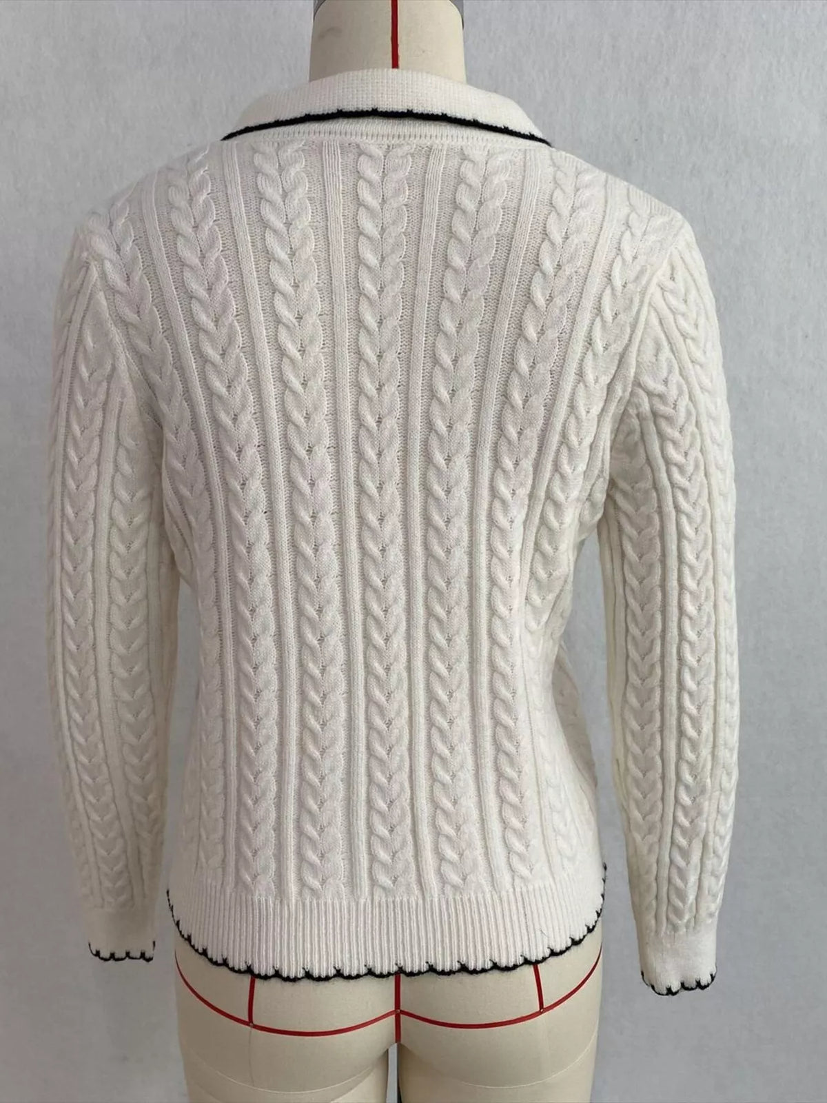 Ivory cable-knit polo-collar cardigan, back on dress form.