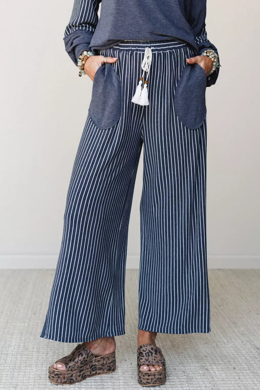 Top and drawstring pants set, blue striped pants front