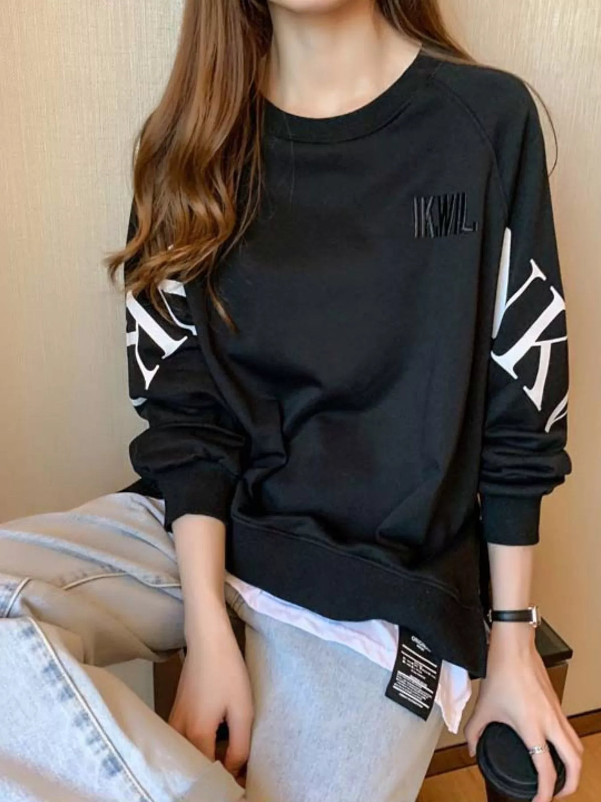 Black layered-hem sweatshirt with graphic sleeve detail