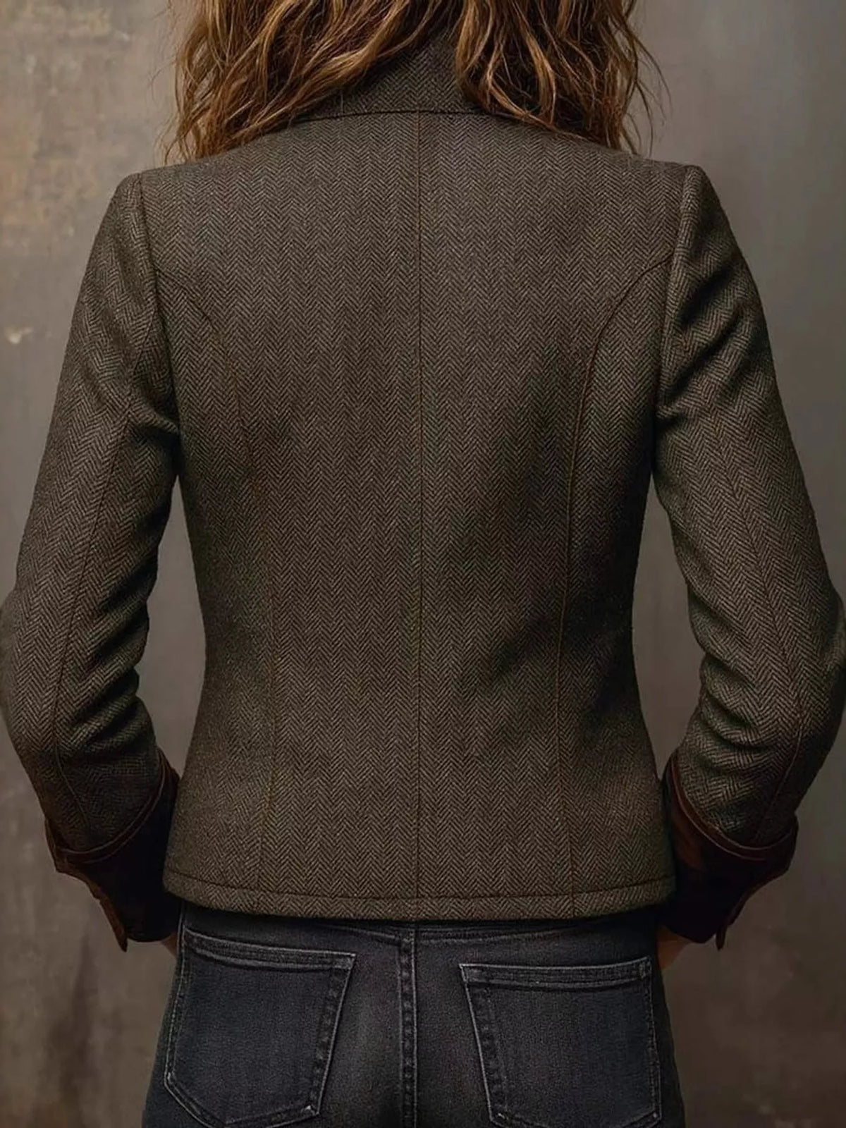 Brown herringbone tweed blazer with velvet cuffs, back view