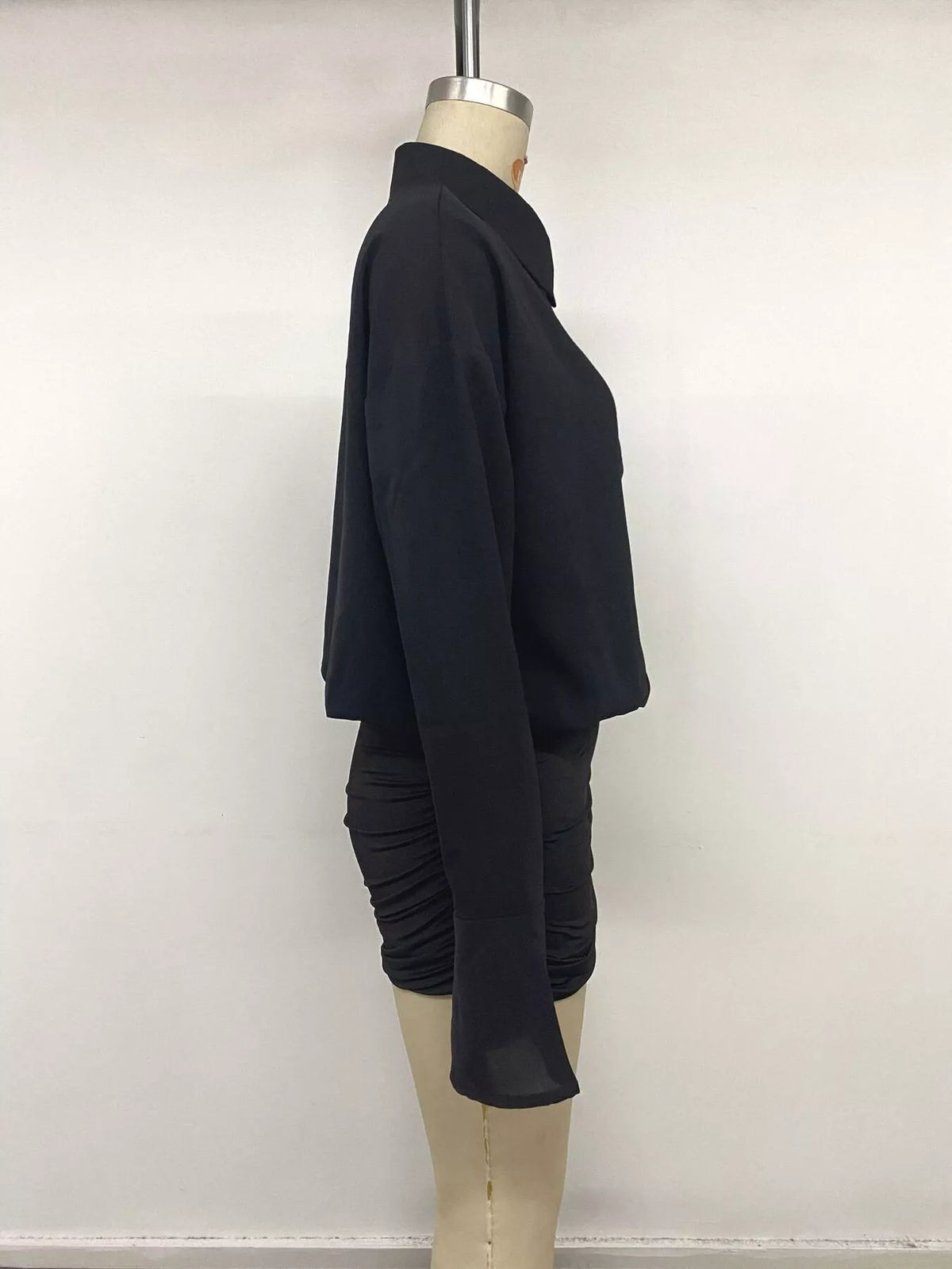 Black flounce sleeve ruched mini shirt dress, side on mannequin