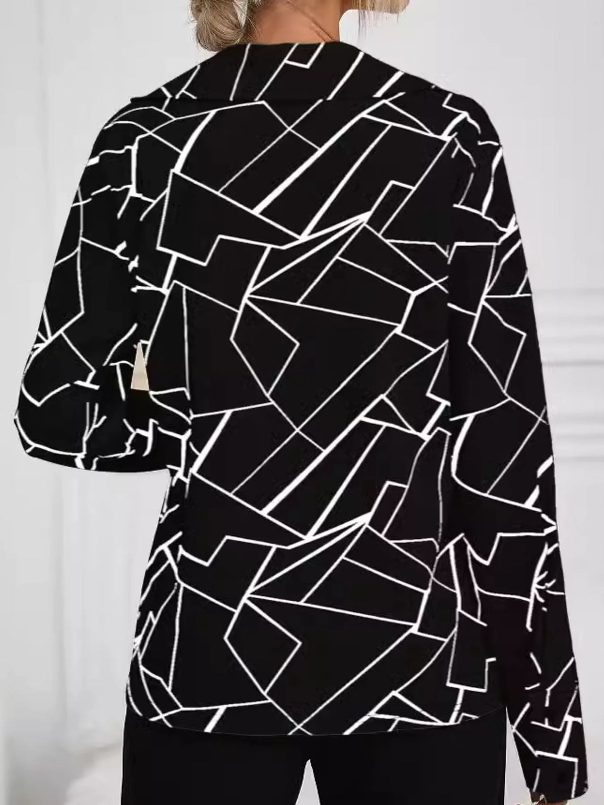 Black geometric print long sleeve blouse, back view