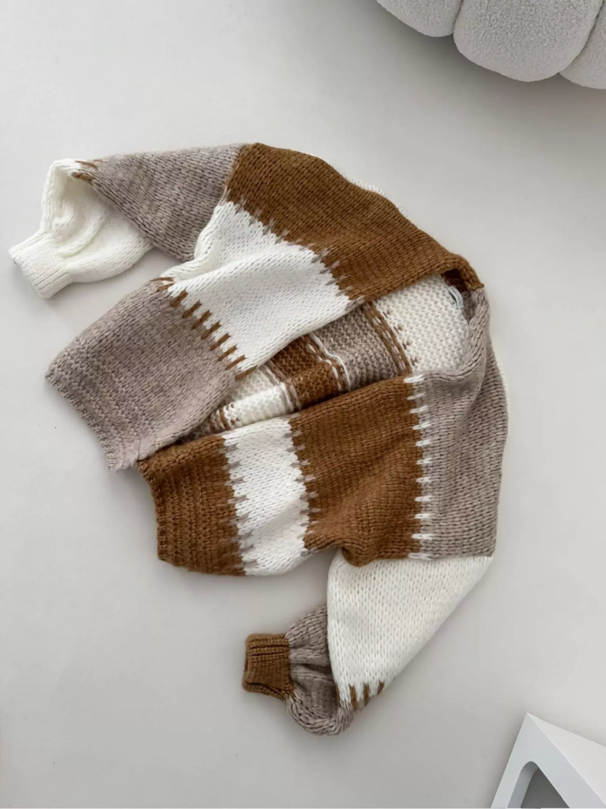 Brown color-block v-neck cardigan, laid-flat view.
