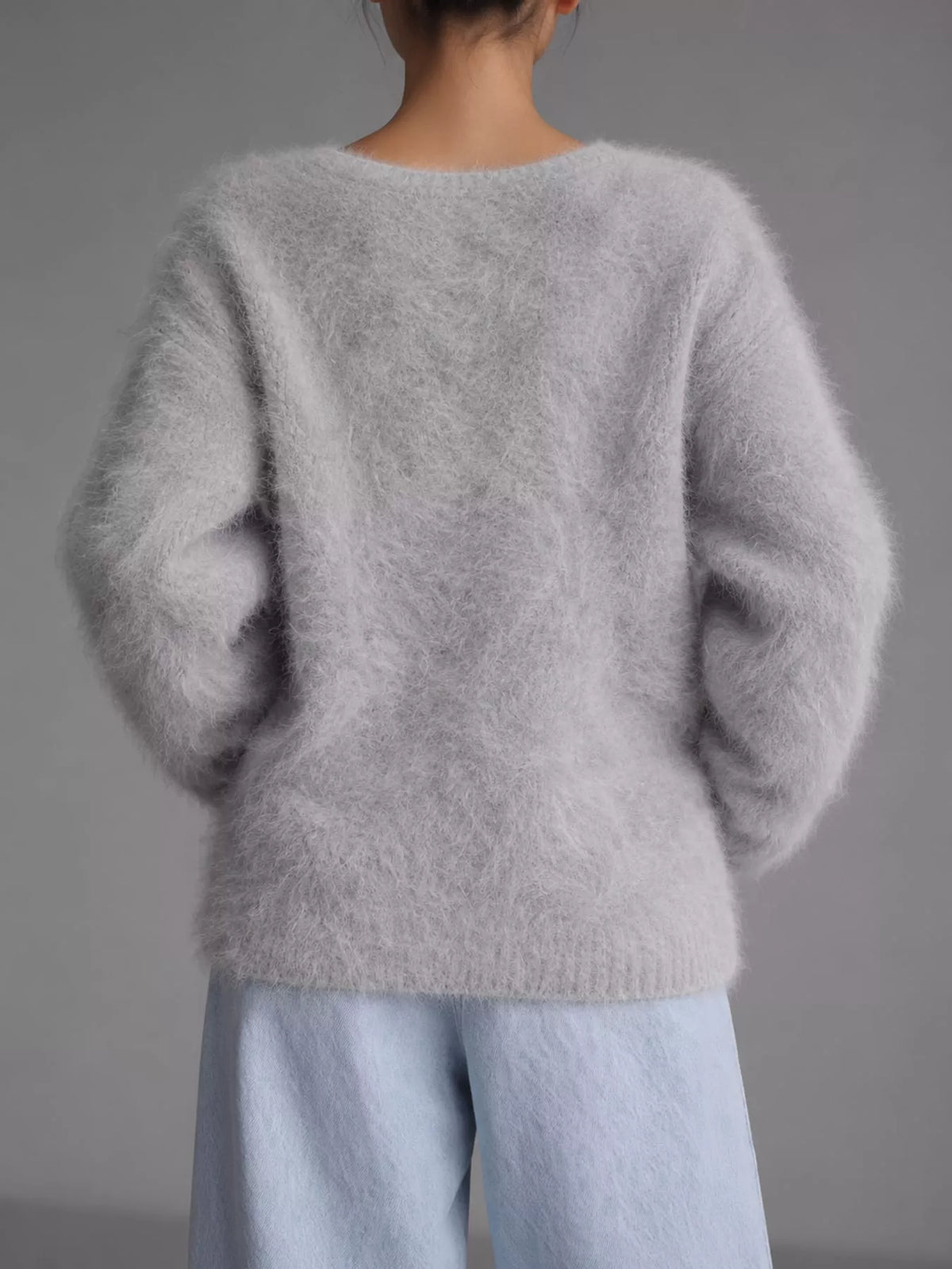 Light gray fuzzy v-neck button-down cardigan, back view