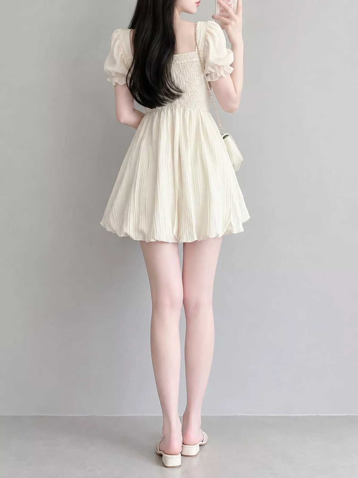 Cream puff-sleeve smocked mini dress with tie-front detail, back view