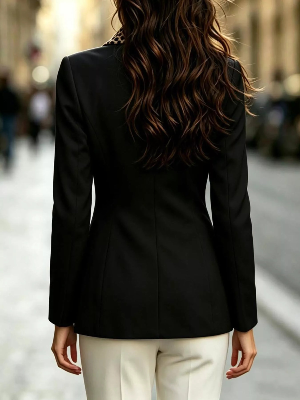 Black double-breasted blazer with leopard print lapel, back view