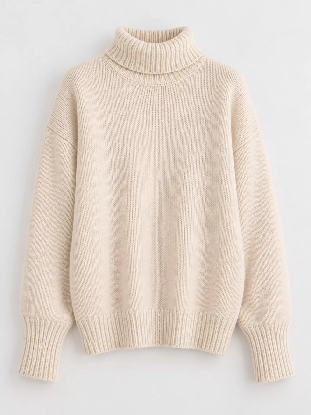 Turtleneck sweater, cream flat lay