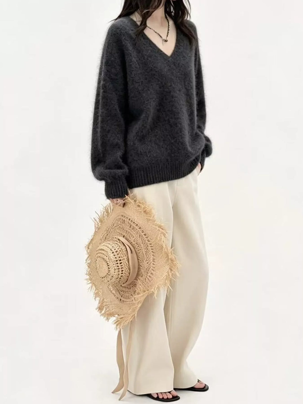 Gray v-neck sweater, side view