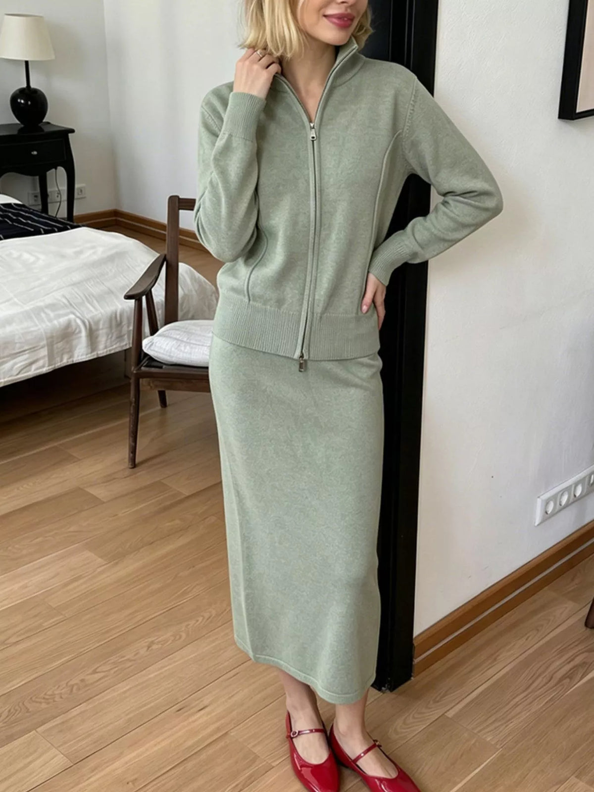 Zip-up cardigan and midi skirt knit set in sage green, hand-on-hip view