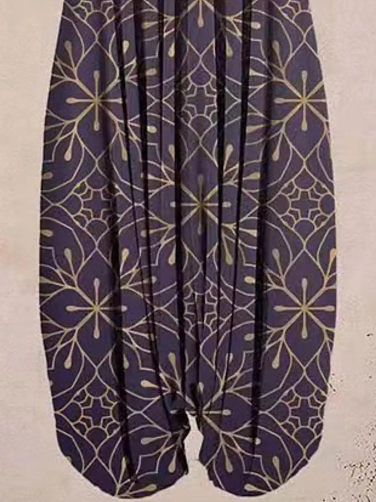 Purple floral-print V-neck sleeveless jumpsuit, leg and print detail