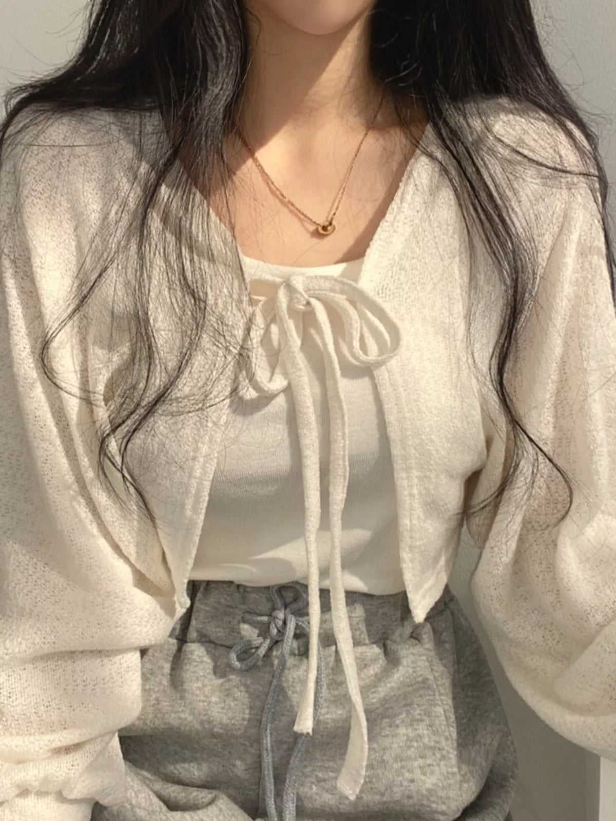 Round neck long sleeve cardigan, front view on model