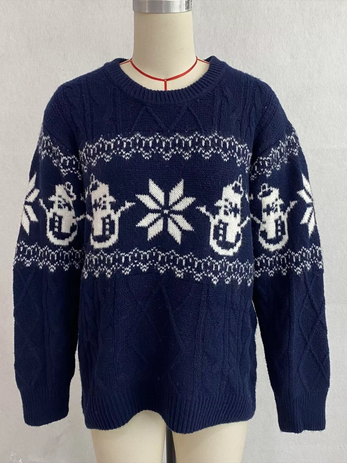 Navy christmas snowman cable-knit sweater, front on dress form.