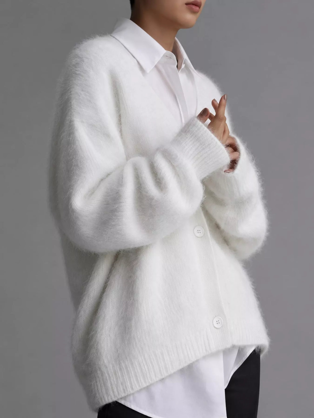 White fuzzy v-neck button-down cardigan, side view