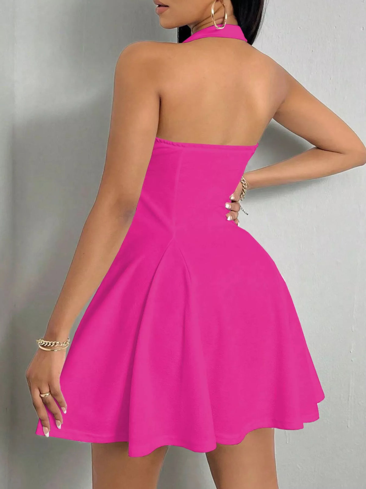 Fuchsia halter-neck a-line mini dress, back view.