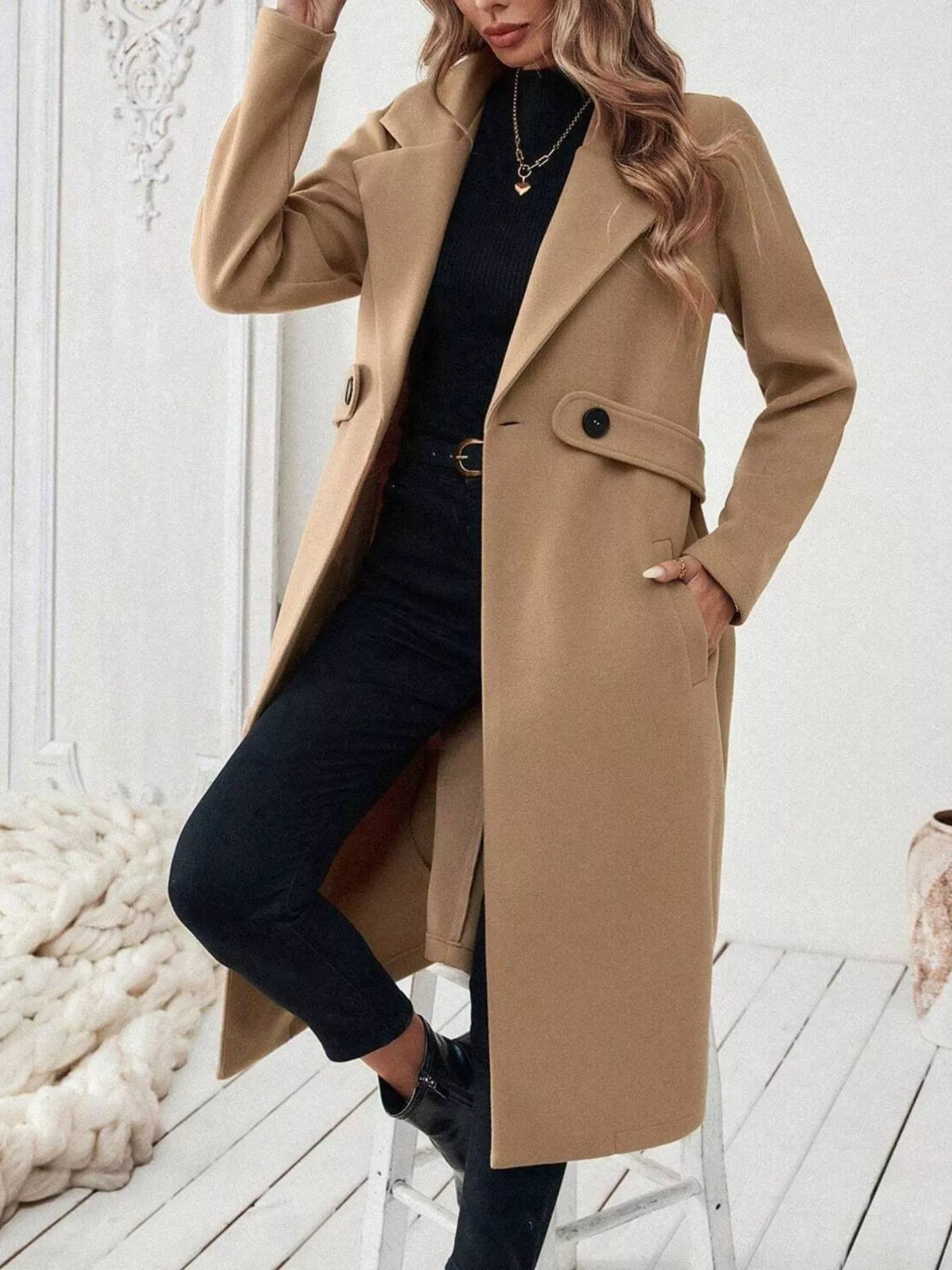 Tan lapel-collar longline coat, open front, knee bent