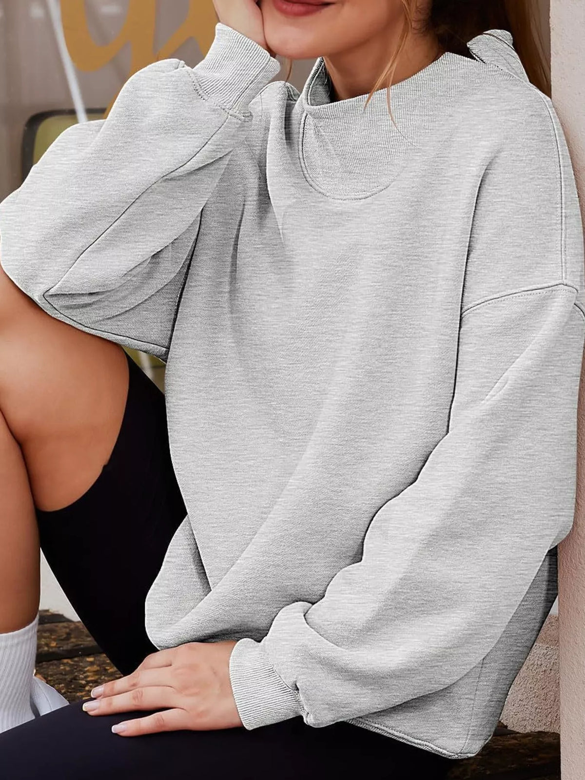 Oversized sweatshirt, gray seated view