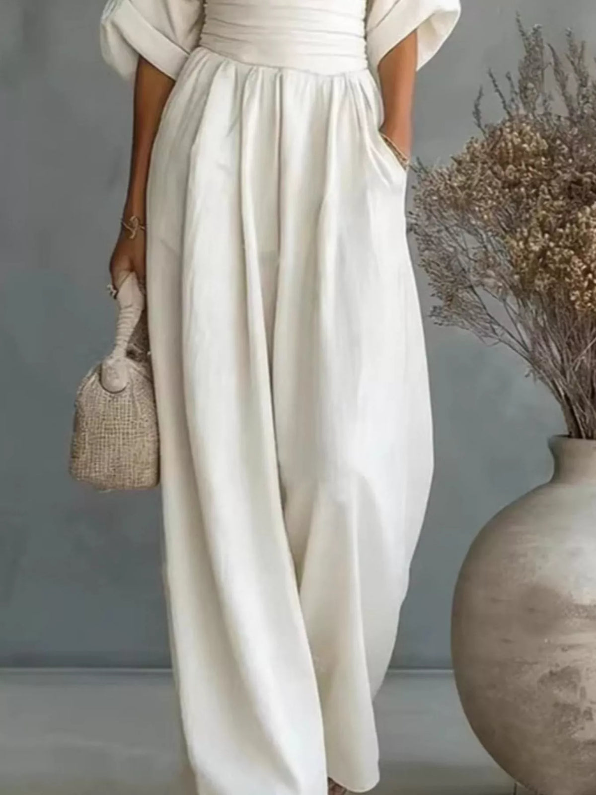 White V-neck wide-leg jumpsuit, waist and leg detail