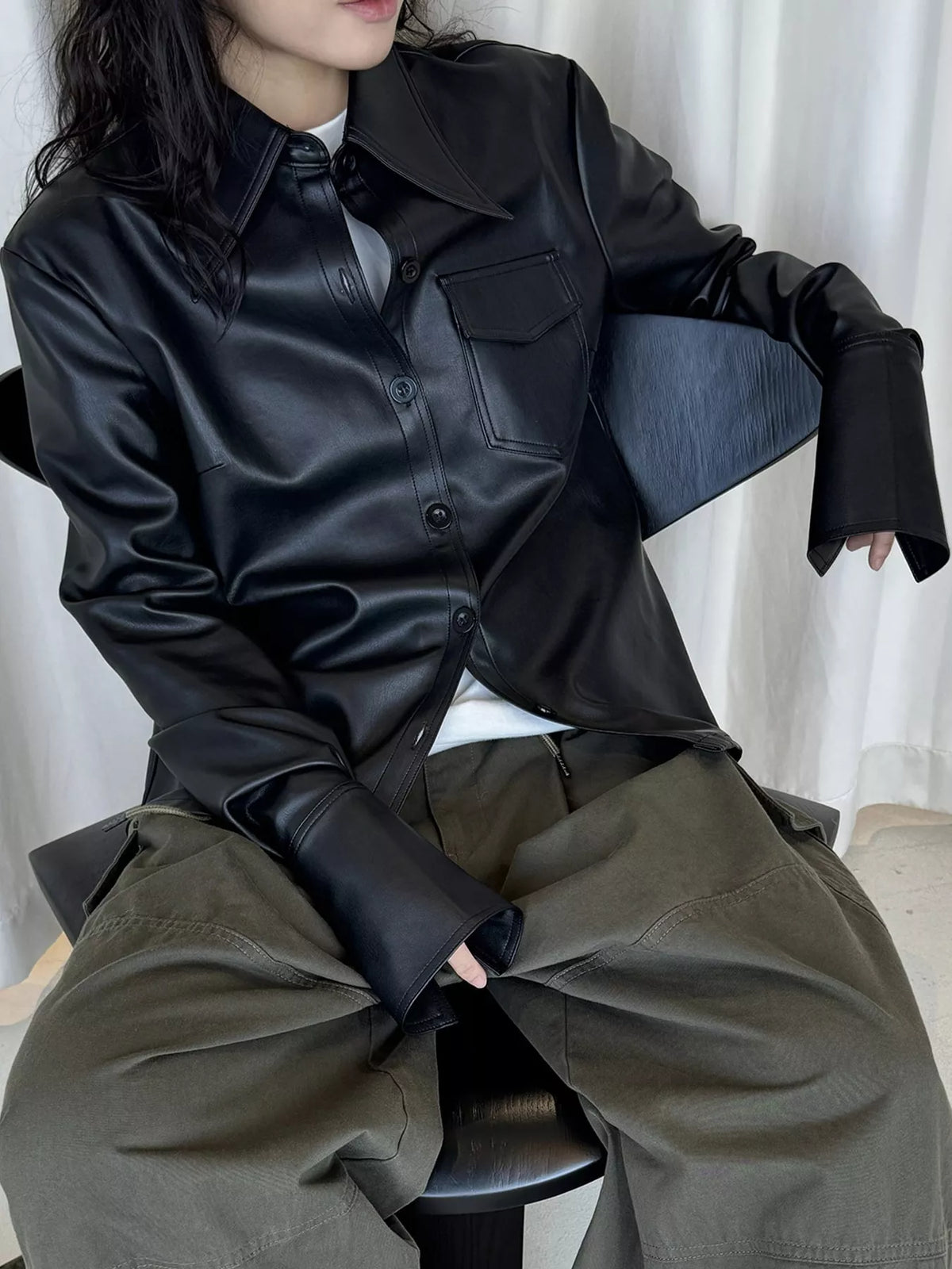 Black faux leather button-front jacket — front view
