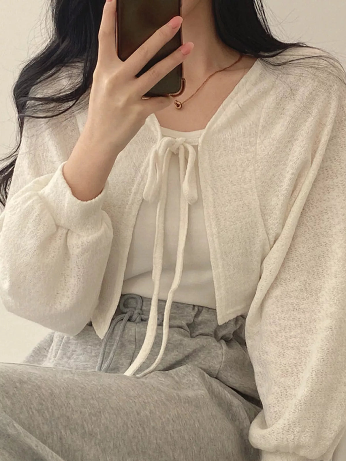 Round neck long sleeve cardigan, front view on model