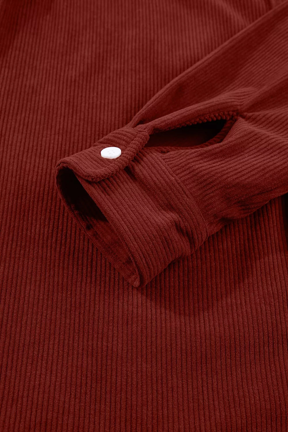 Rust corduroy button-down shirt, button cuff detail