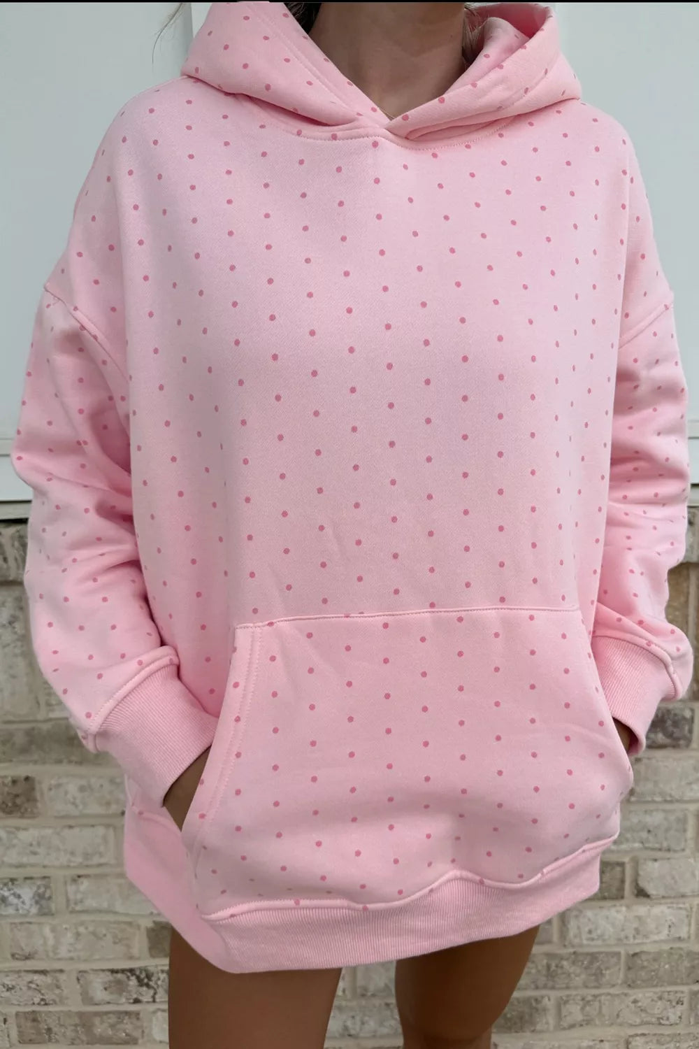 Pink polka dot oversized hoodie and shorts set — front view