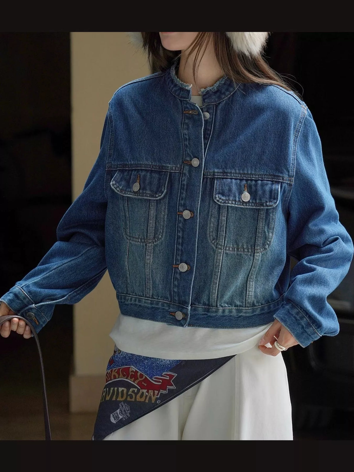 Blue button-up cropped denim jacket — front view