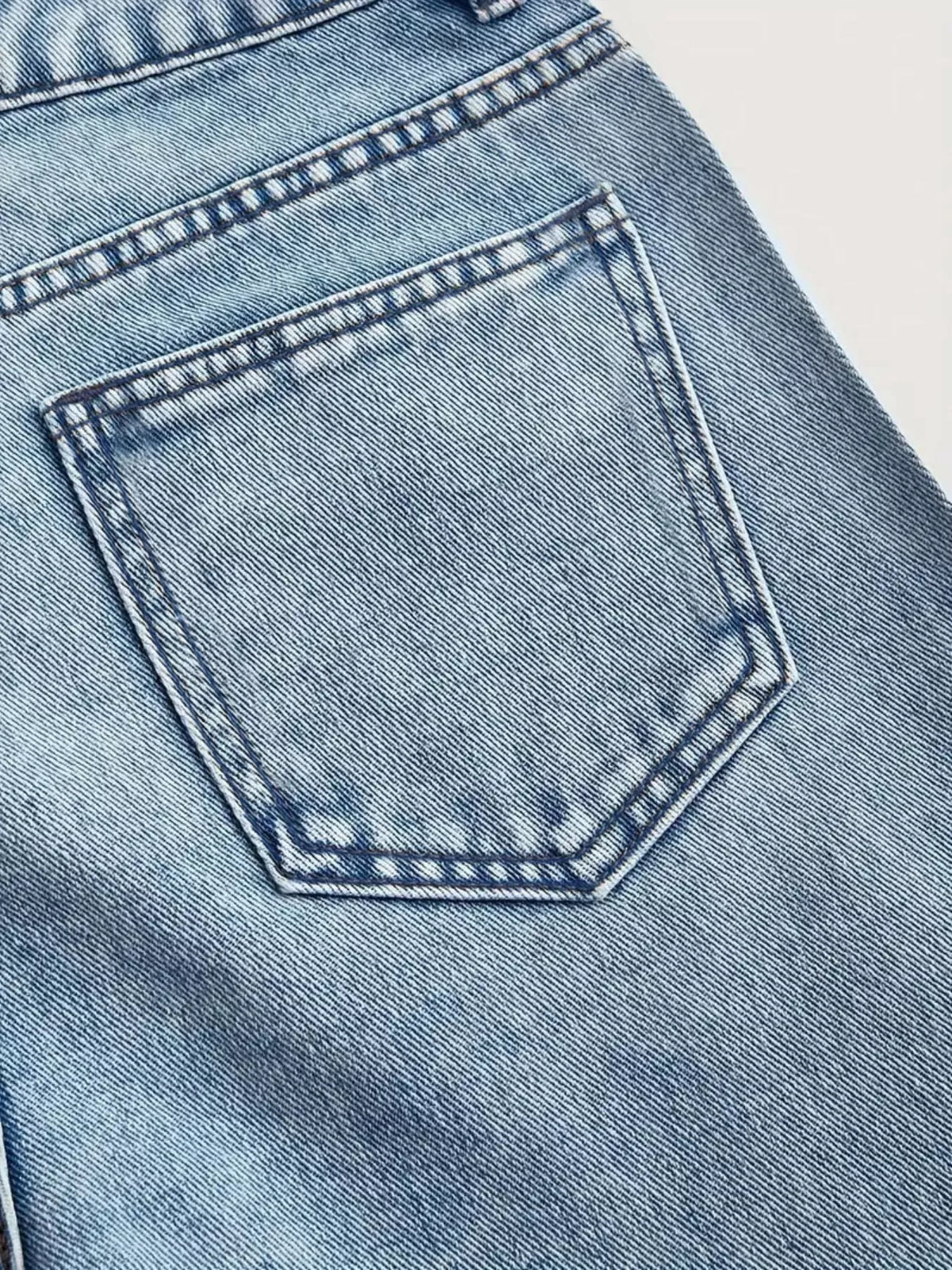 Light blue high-waisted rhinestone wide-leg jeans — design and construction details