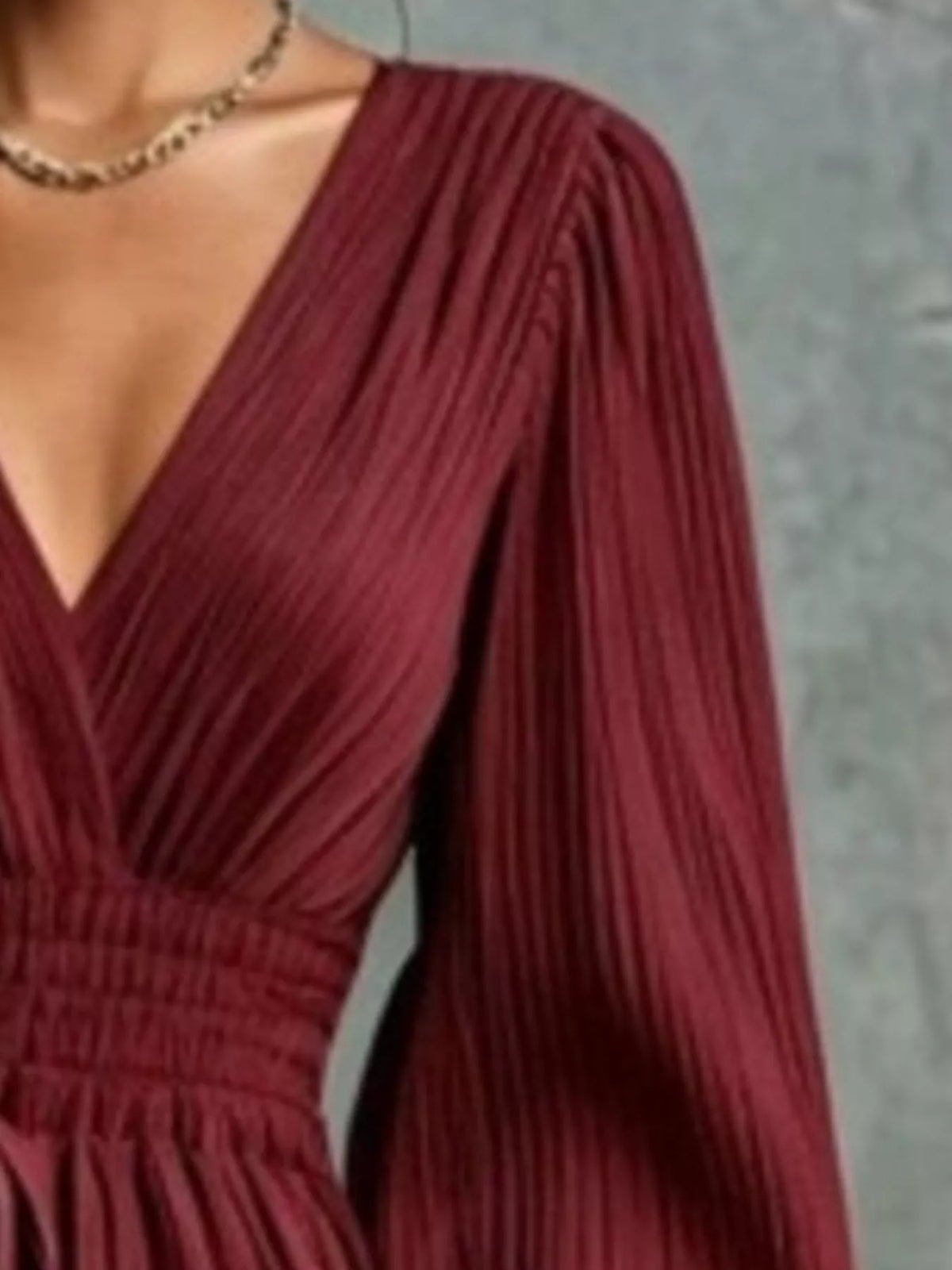 Burgundy pleated v-neck tie-waist maxi dress, pleated bodice and sleeve detail.