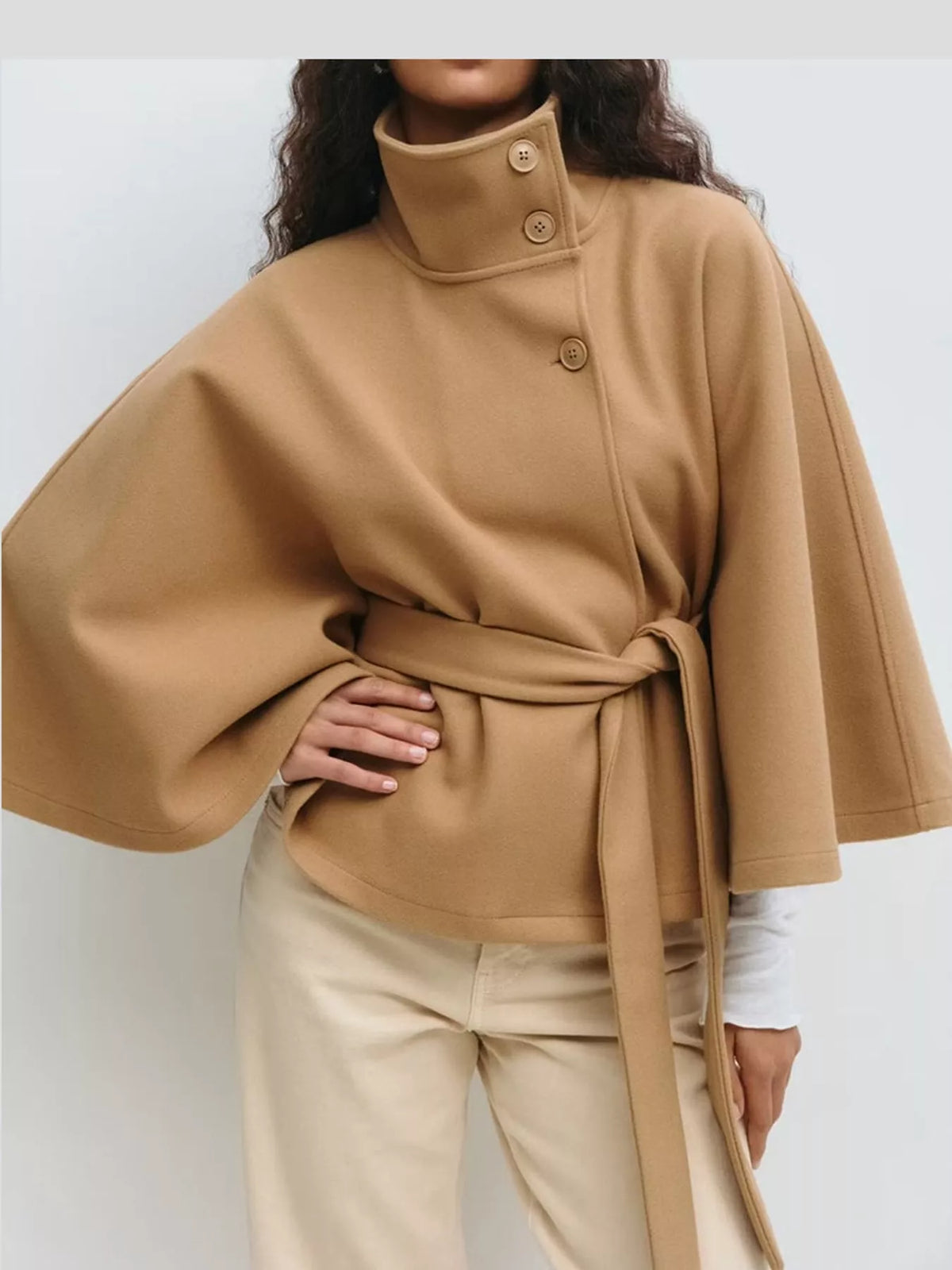 Tan belted button-front cape — front view