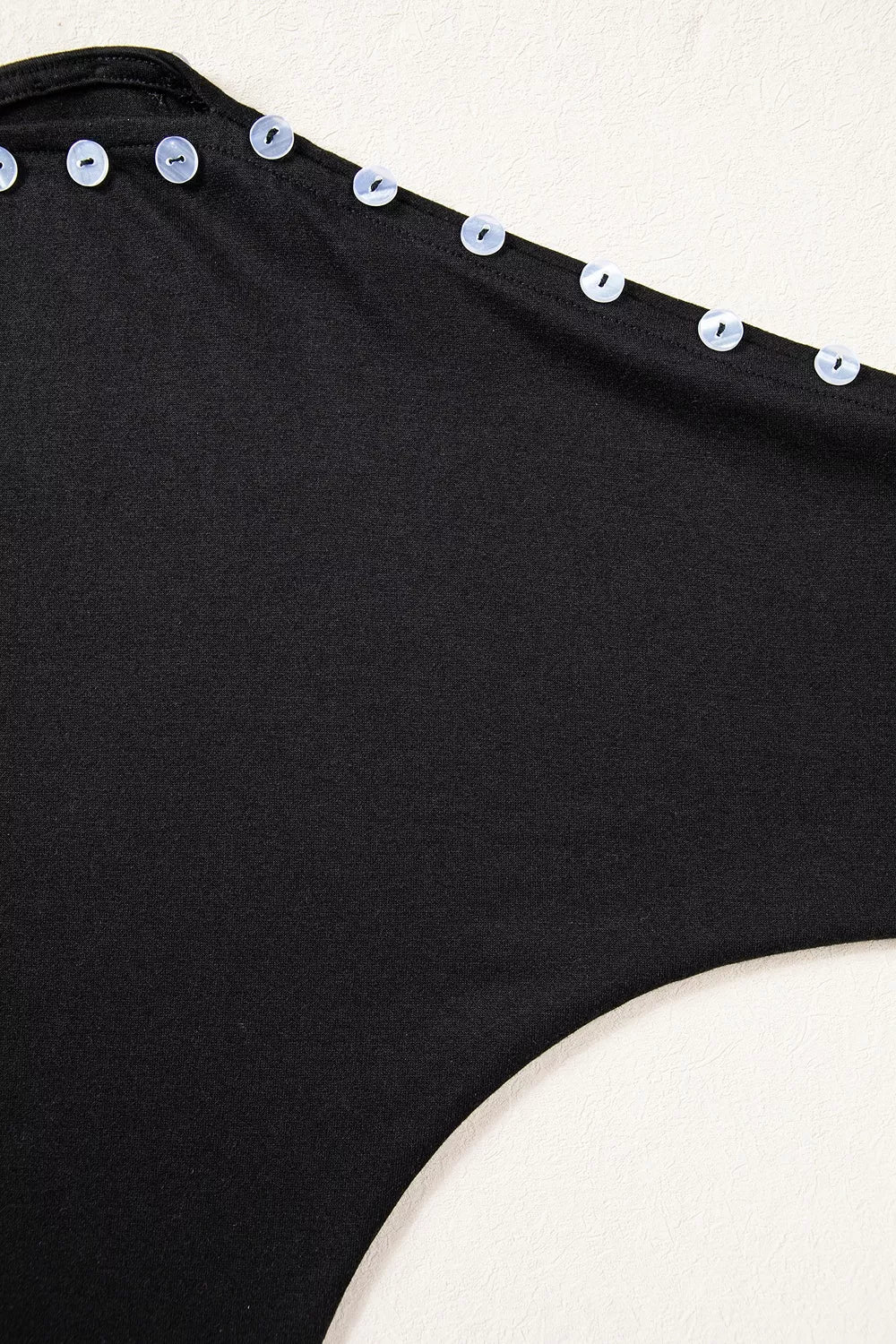 Black off-shoulder button-detail three-quarter sleeve top, shoulder button detail