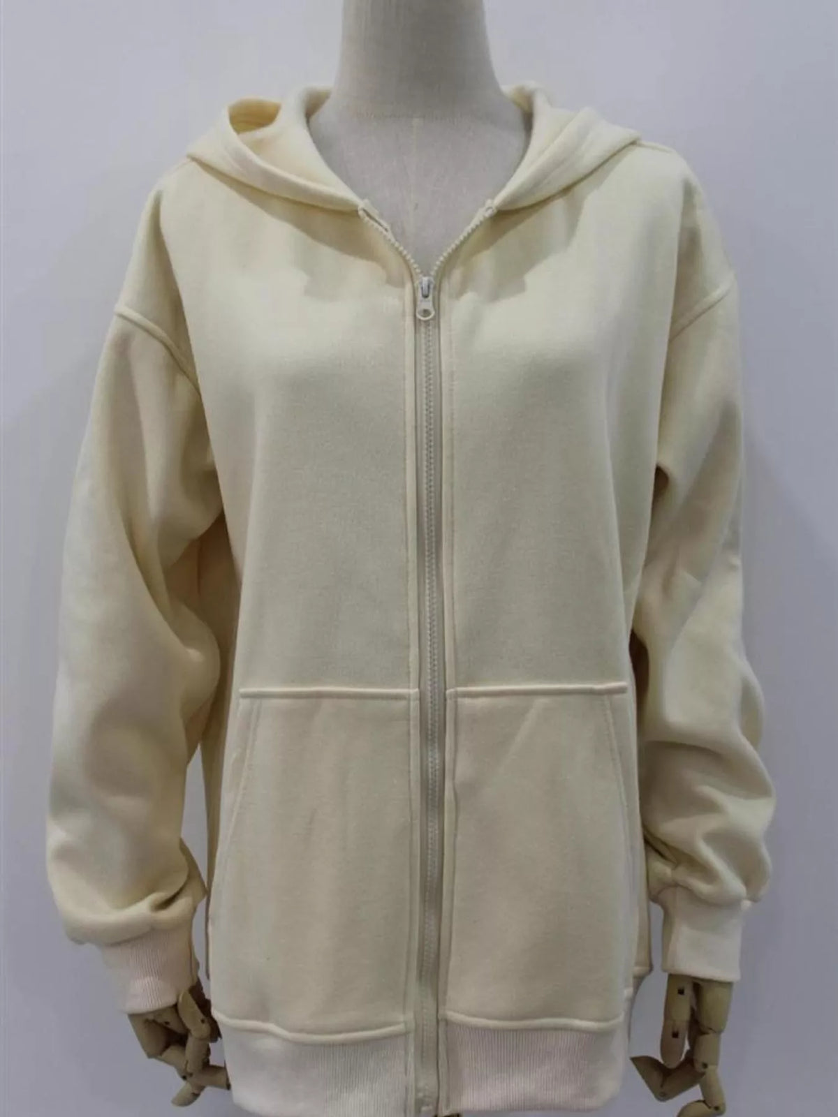 Women's Zip-Up Dropped Shoulder Hoodie in cream — mannequin front view