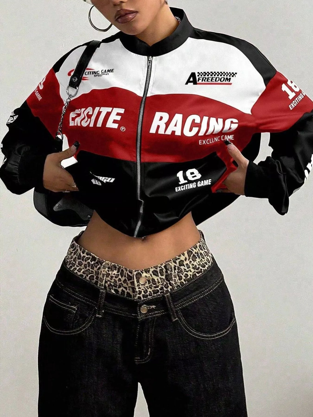 Black and red letter-print zip-front jacket, front view with hand at waist