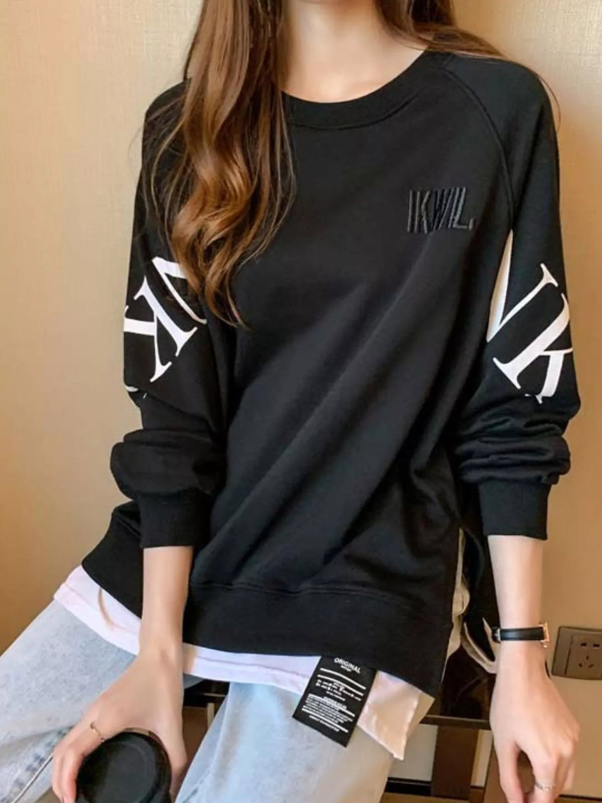 Black layered-hem sweatshirt with graphic sleeve detail